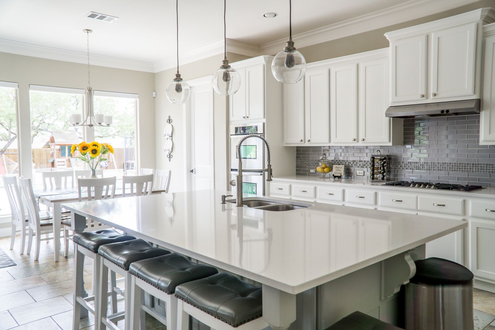 Bright, freshly cleaned kitchen with sunflowers on the island